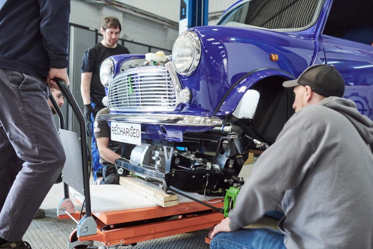 The gear box for the new electric battery engine is being fitted into the MINI Recharged model in a workshop in Bristol.  