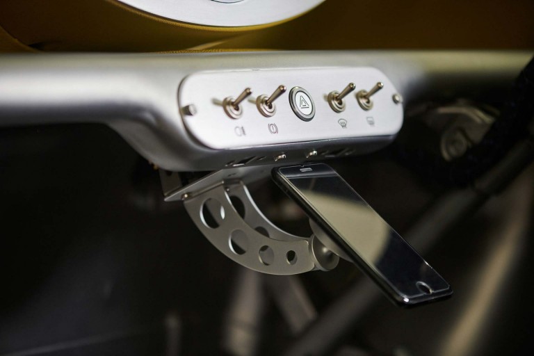 Magnetic: Close-up of a mobile phone to show that it can be clipped below the switches of the redesigned dashboard. 