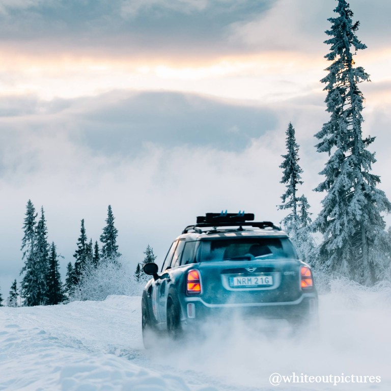 MINI COOPER COUNTRYMAN outdoors in the snow rear view